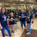 Joanne Strong (far right), spouse of NY IV member John Strong, joins three generations of the Mazurkiewicz family, including Tony's spouse, Lynn (second from right), at Roc On Harley-Davidson in Henrietta.